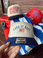 Load image into Gallery viewer, Lake it Easy American Flag Trucker Hat